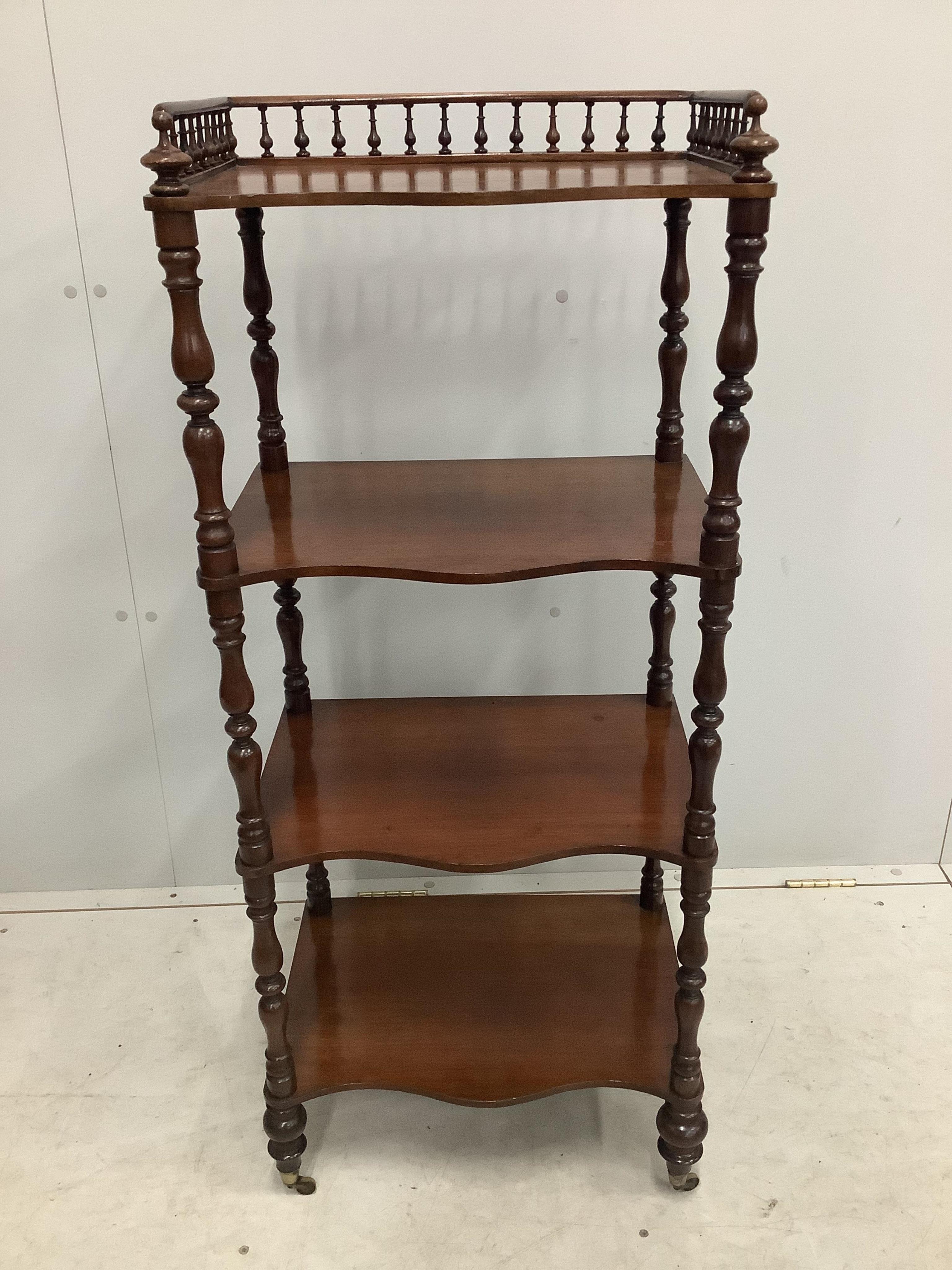 A Victorian four tier mahogany whatnot with a galleried top, width 47cm, depth 33cm, height 113cm. Condition - fair